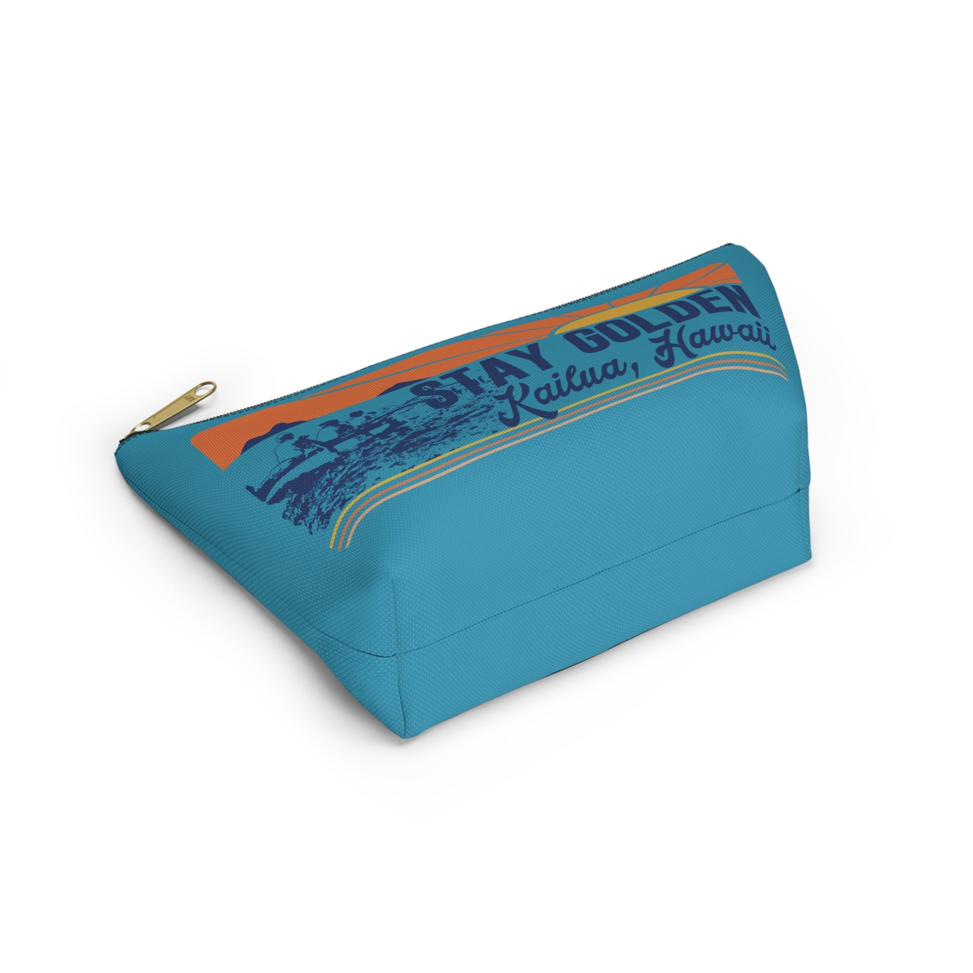 A turquoise blue zippered pouch featuring a retro-style graphic print with the text 'STAY GOLDEN Kailua, Hawaii' and a sunset design, shown on a plain white background.