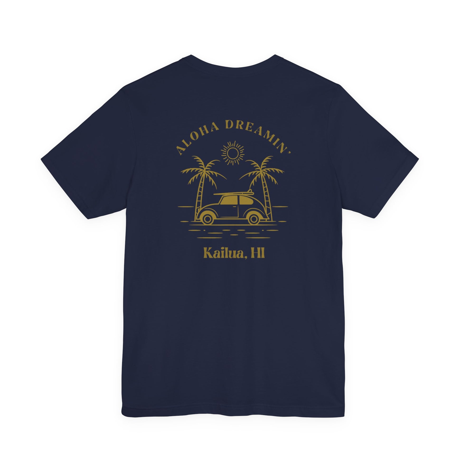 A navy short-sleeve t-shirt shown from the back, featuring a gold-colored retro graphic of a classic car between two palm trees with the text 'ALOHA DREAMIN'' and 'Kailua, HI'.