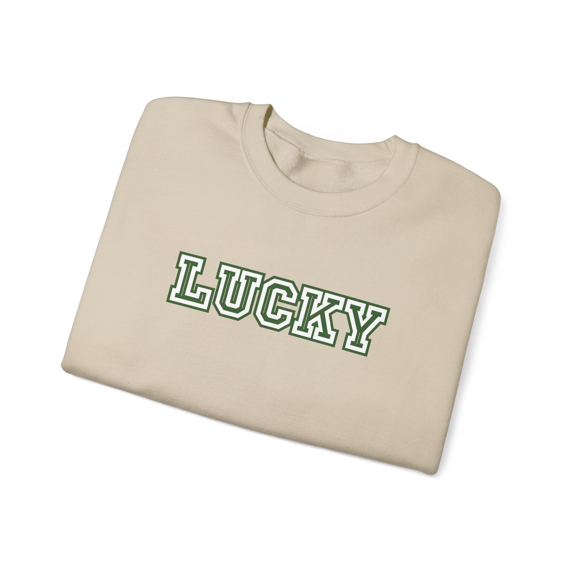 Folded beige sweatshirt with 'LUCKY' printed in green on a white background
