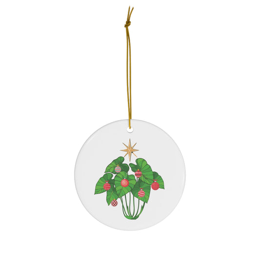 White ceramic Kalo Kalikimaka ornament featuring green kalo leaves decorated with red Christmas ornaments and a golden star.