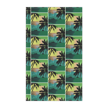 A tea towel featuring a repeating tropical sunset pattern with black palm tree silhouettes over teal, green, yellow, and peach horizontal bands, 'KAILUA HAWAII' shown on a white background.