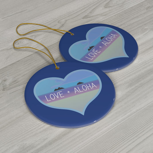Blue ceramic ornament with heart-shaped Kailua ocean scene, Mokulua islands and Love + Aloha lettering.