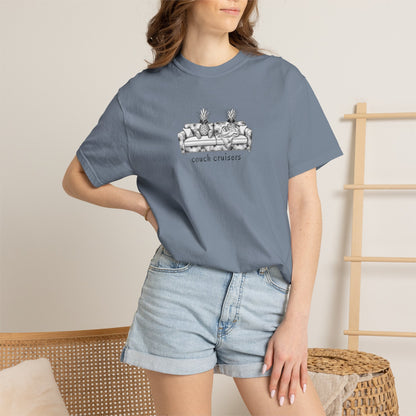 Woman wearing blue Couch Cruisers Comfort Colors graphic tee with denim shorts