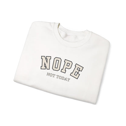 A folded white crewneck sweatshirt with 'NOPE NOT TODAY' printed on the front in a gray and white varsity-style font, set against a plain white background.