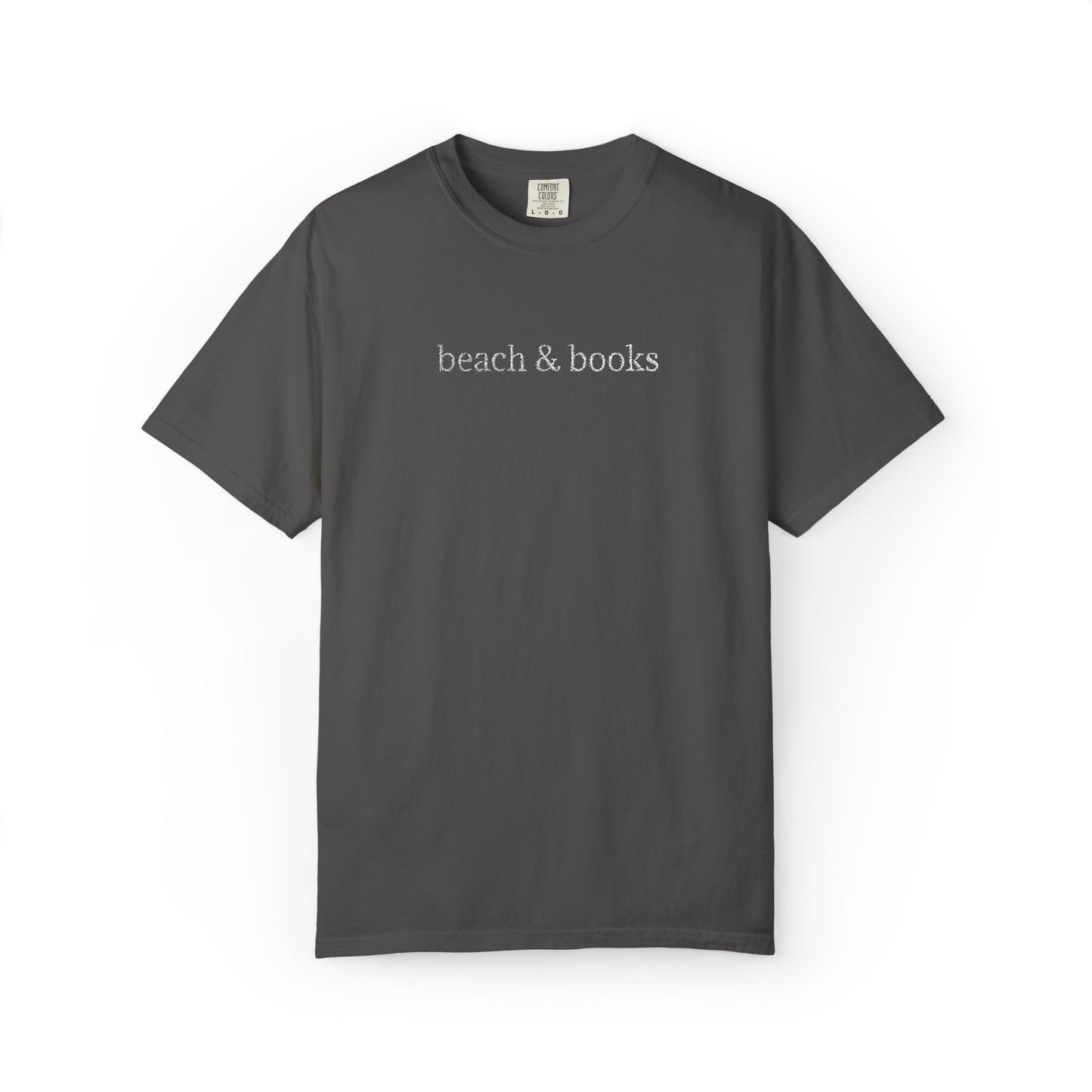 A dark grey comfort colors tee with 'beach & books' embroidered in white.