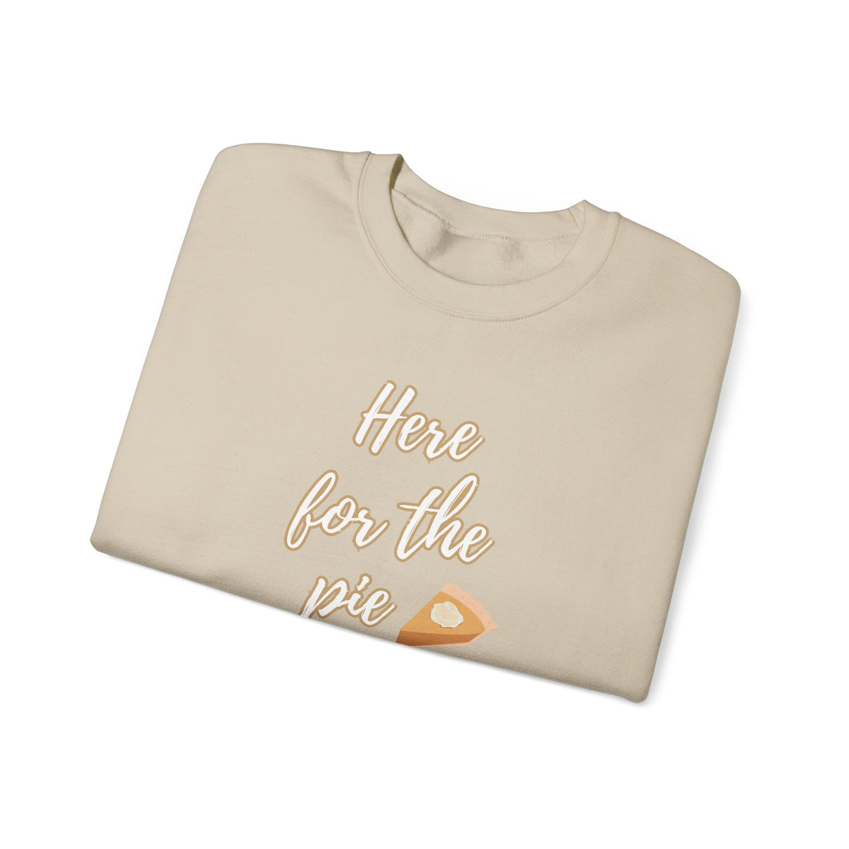 A beige crewneck sweatshirt folded neatly on a white background, featuring the text 'Here for the pie' in a light tan script with a slice of pumpkin pie graphic.