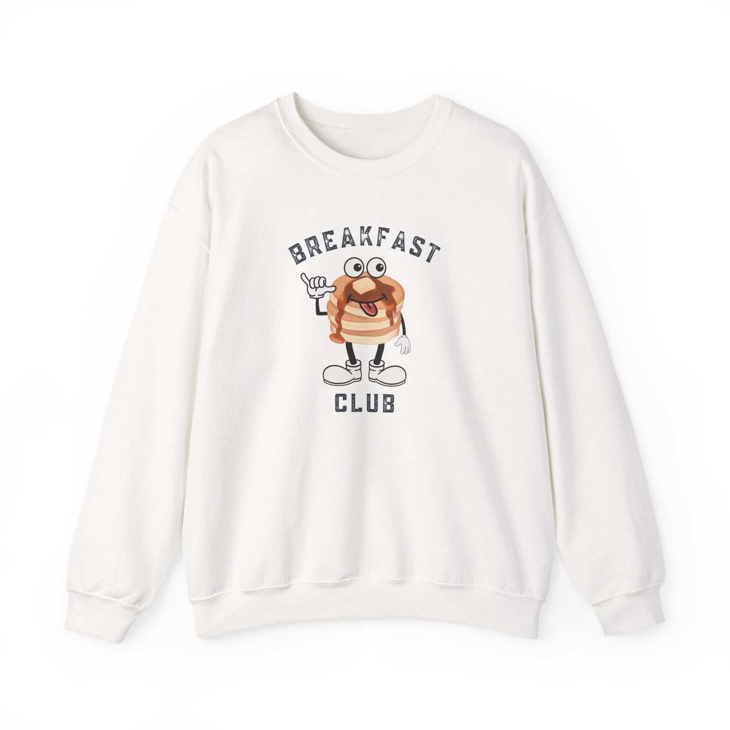 A white crewneck sweatshirt featuring a cartoon graphic of a breakfast stack of pancakes character with the text 'BREAKFAST CLUB' printed on the front, displayed against a clean white background.