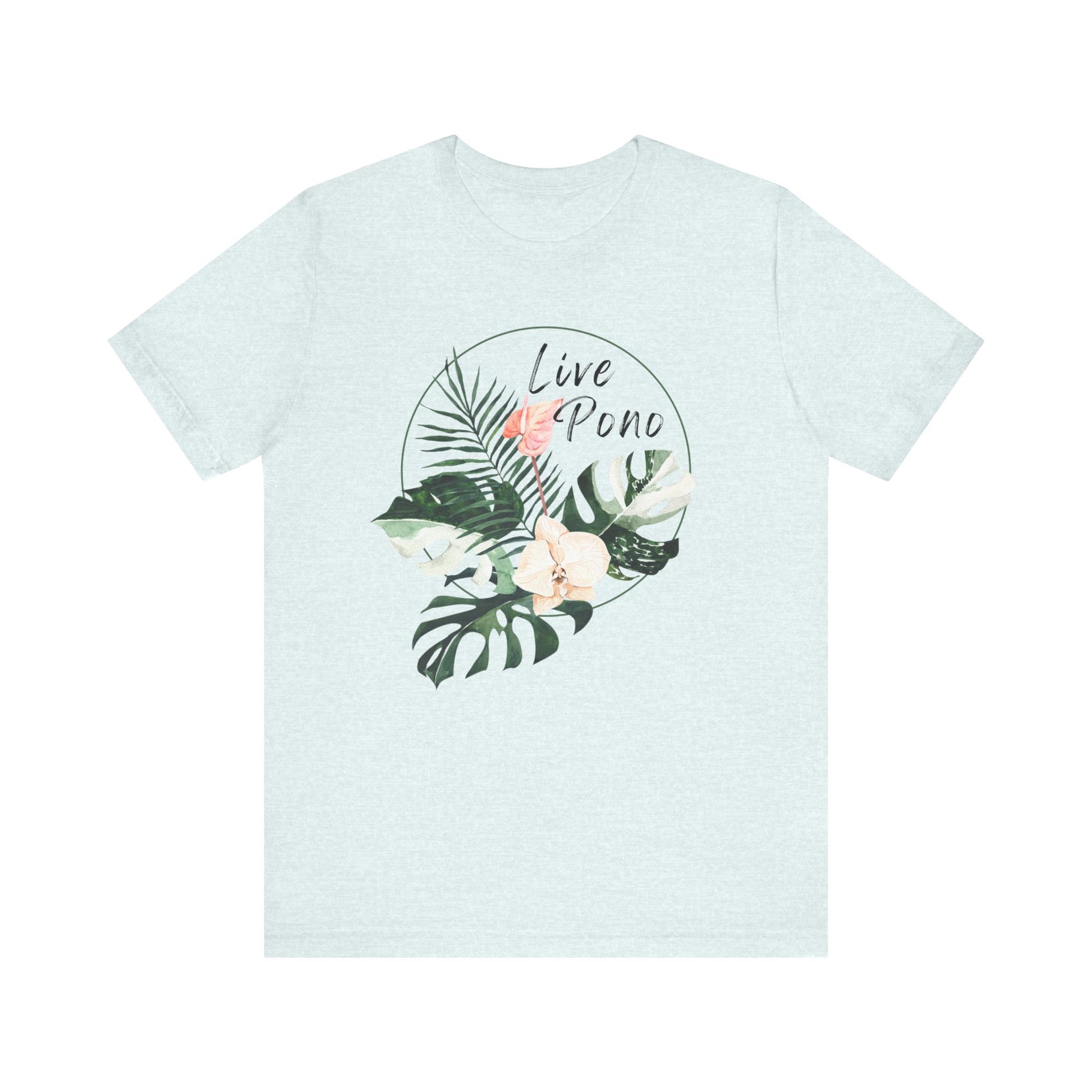 A light heather blue short-sleeve crewneck t-shirt featuring a circular tropical graphic on the chest with green leaves, a pink flower, and the words 'Live Pono' in black script.