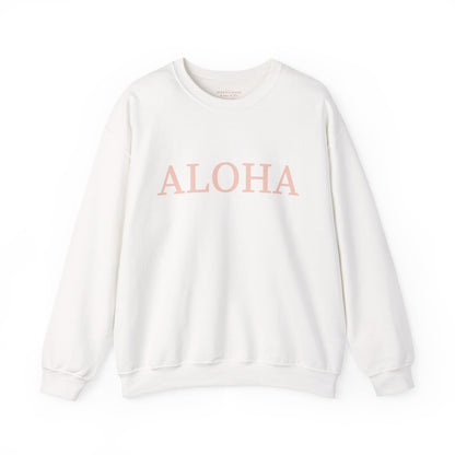 An off-white crewneck sweatshirt with the word 'ALOHA' printed across the chest in a dusty pink tone, displayed on a clean white background.