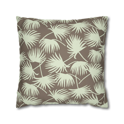 A square throw pillow featuring a repeating palm leaf pattern in sage green on a warm taupe-brown background, shown against a plain white studio background.