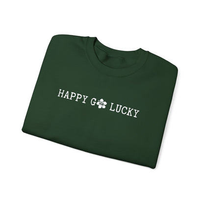 Folded green sweatshirt with 'Happy Go Lucky' text on a white background