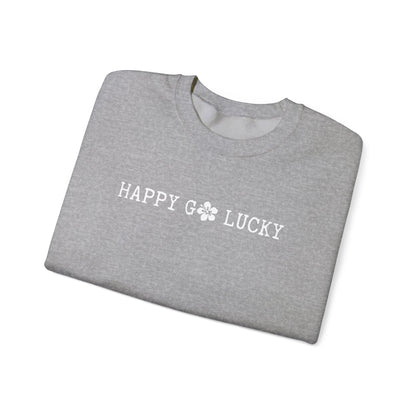 Folded gray t-shirt with 'Happy Go Lucky' text on a white background