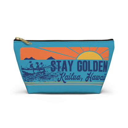 A rectangular zippered pouch with a retro sunset graphic and the text 'STAY GOLDEN Kailua, Hawaii' on a white background.