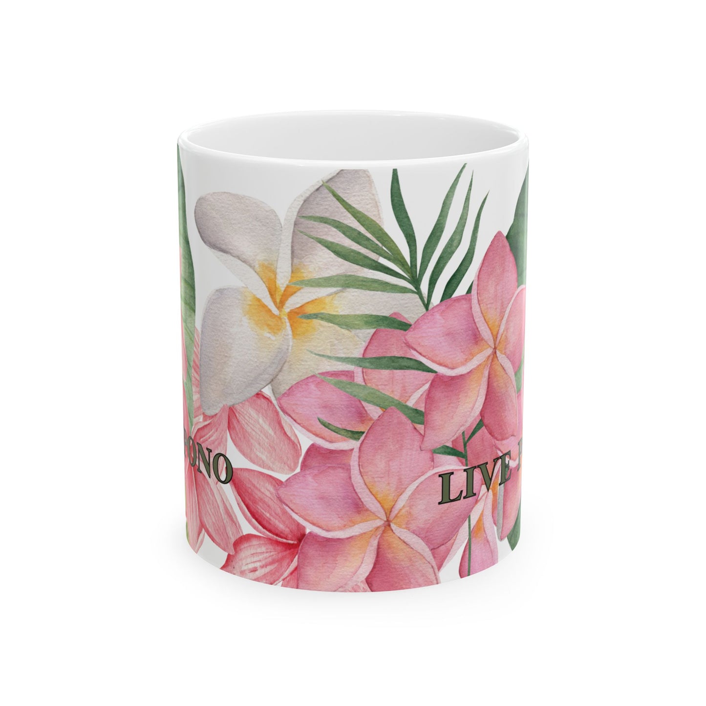 A white ceramic mug featuring a tropical floral print with pink plumeria, a white frangipani, green palm leaves, and the words 'LIVE PONO'.