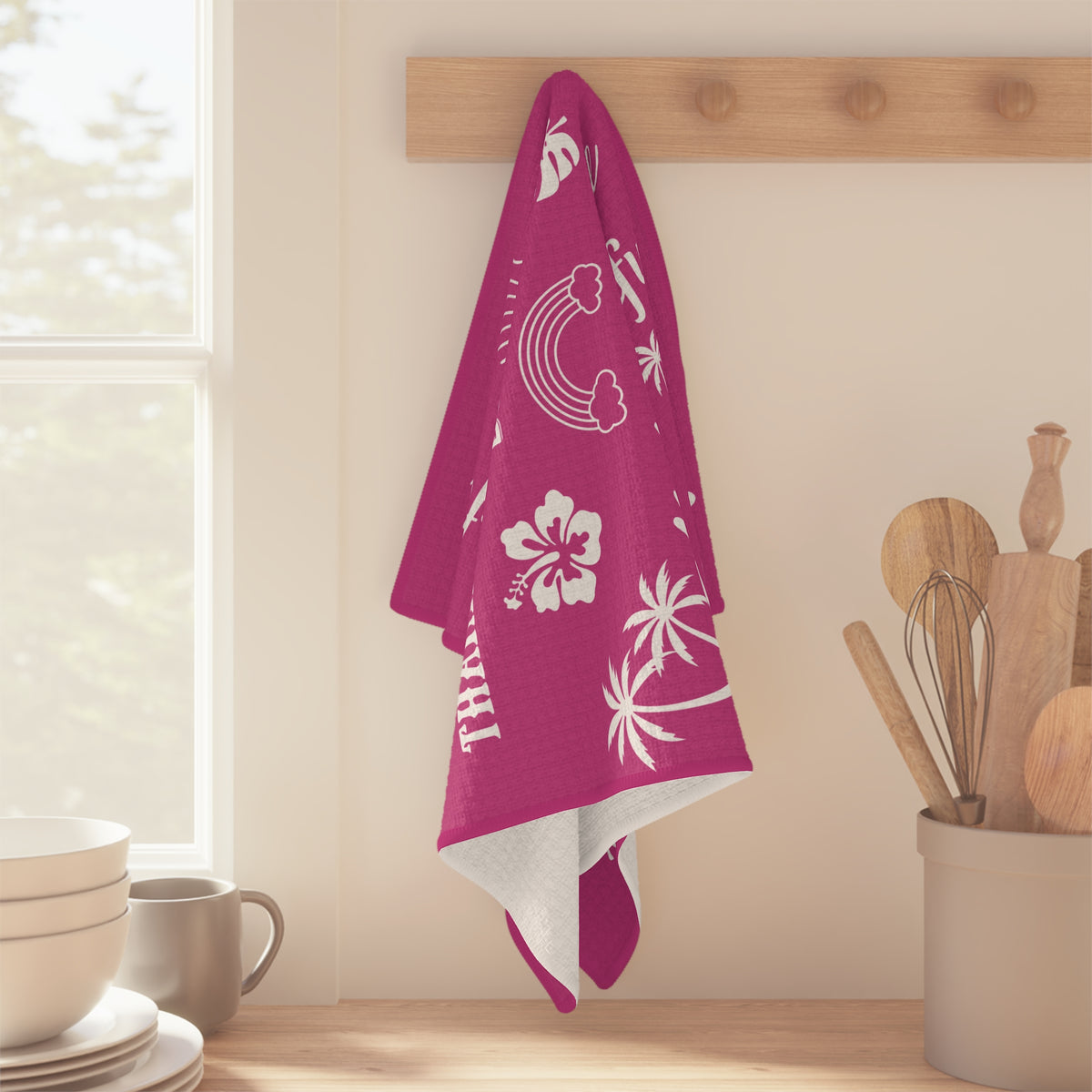 Raspberry Mahalo Mode kitchen towel with thankful grateful blessed and tropical island motifs hanging from a wood peg.