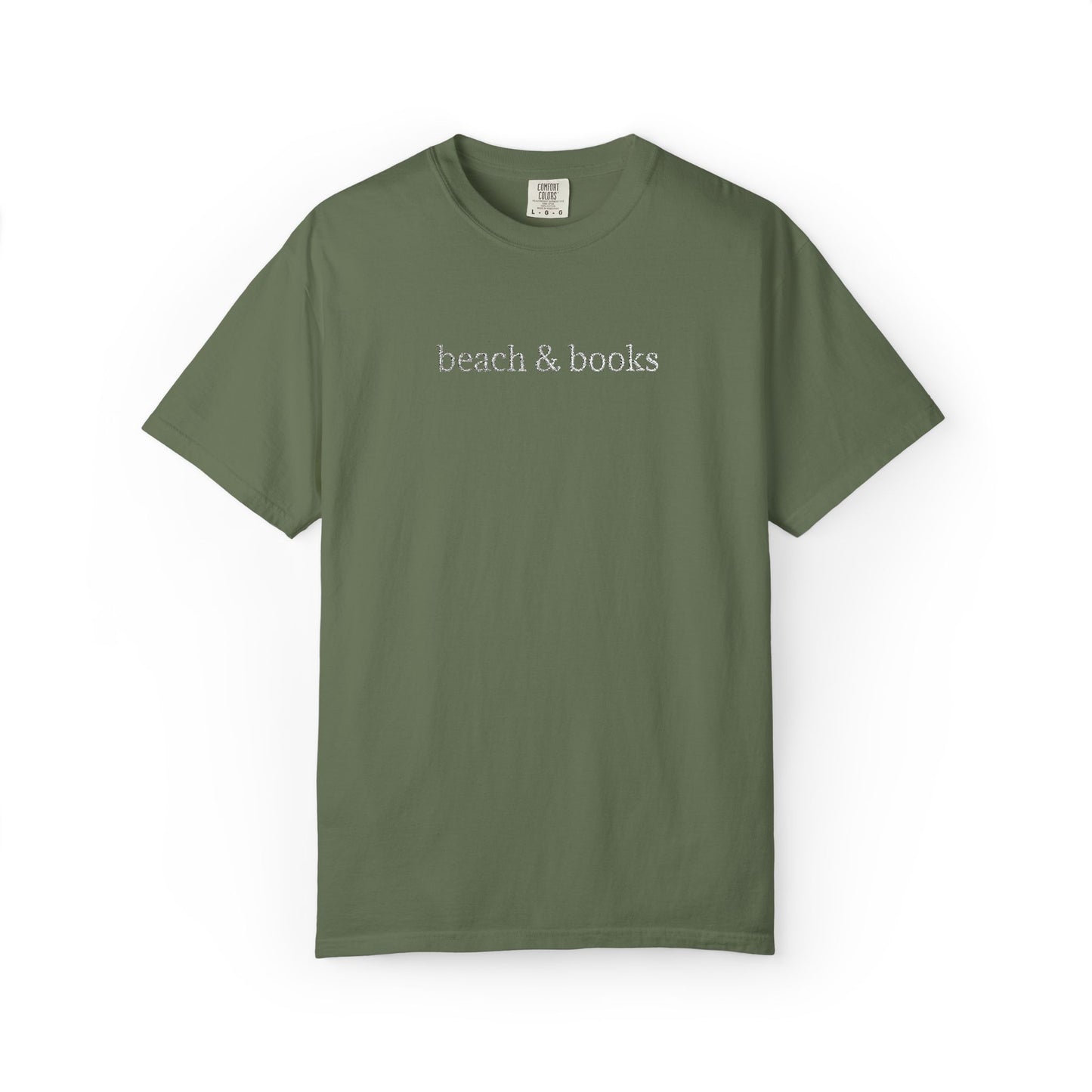 An olive comfort colors tee with 'beach & books' embroidered in white.