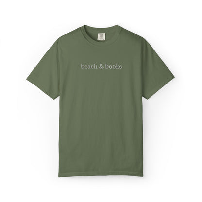 An olive comfort colors tee with 'beach & books' embroidered in white.