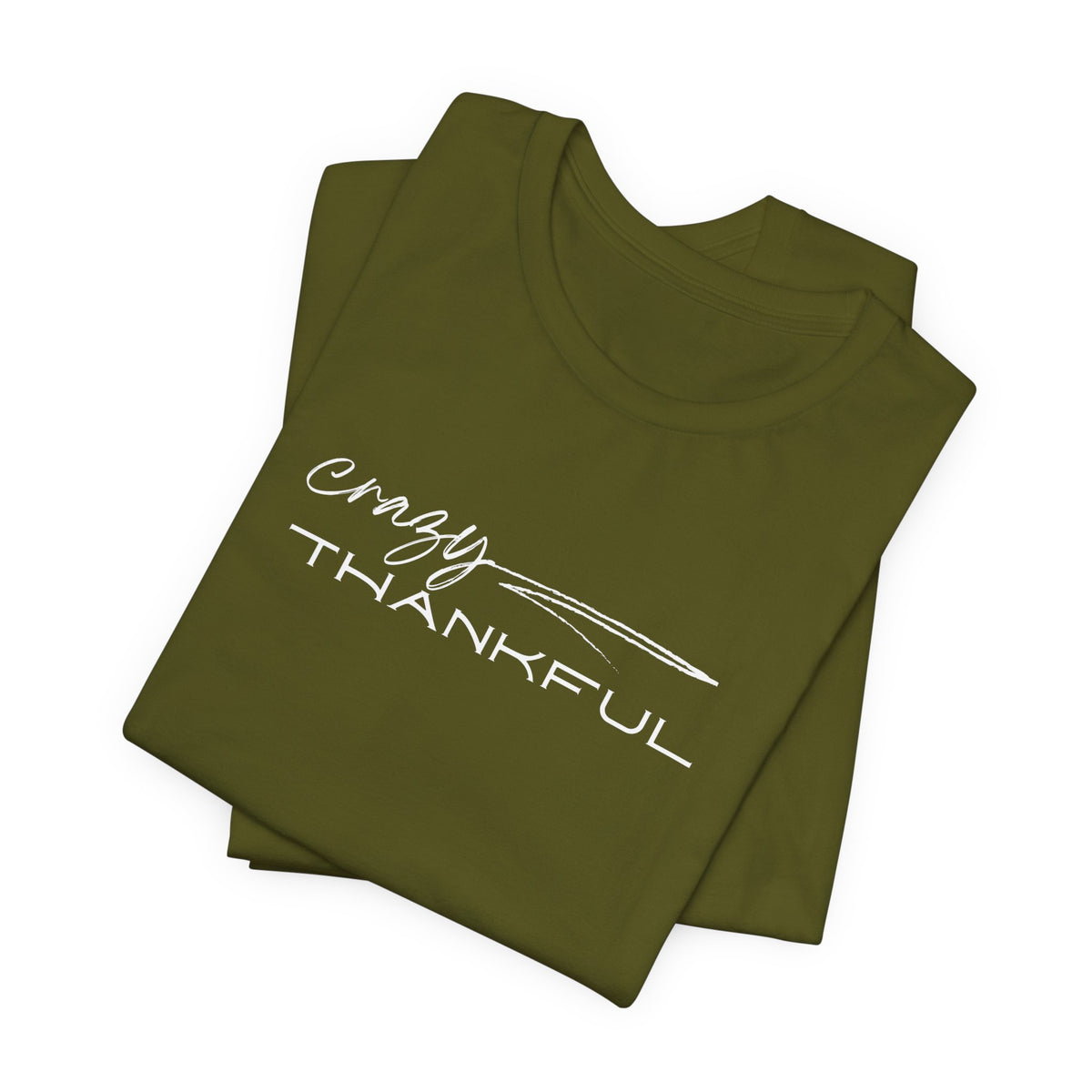 A folded olive Crazy Thankful graphic t-shirt by Global Village Kailua