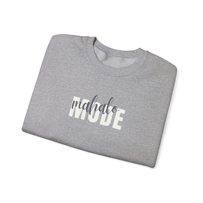A folded sport grey crewneck sweatshirt with 'mahalo MODE' printed across the chest, featuring 'mahalo' in a dark gray script font and 'MODE' in a white block font, displayed on a clean white background.