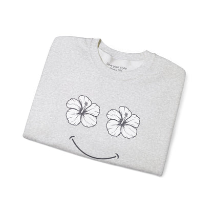 Grey folded Happy Hibiscus Sweatshirt featuring a cheerful hibiscus flower smile design inspired by island life and aloha style.