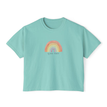 A mint green short-sleeve crop top t-shirt featuring a colorful watercolor-style rainbow graphic on the chest with the text 'ALOHA VIBES' underneath, displayed on a clean white background.
