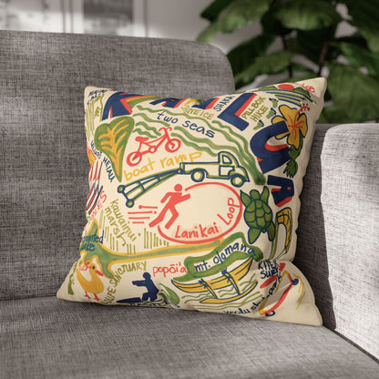 Decorative faux suede throw pillow cover featuring an original hand-drawn illustration of Kailua, Hawaii landmarks, beaches, surfing, paddling, turtles, and island icons on a grey couch.