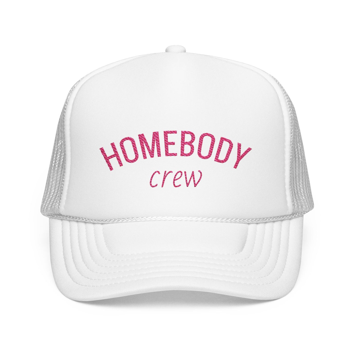 A white trucker hat with pink embroidered text reading 'HOMEBODY crew' on the front panel, shown against a plain white background.
