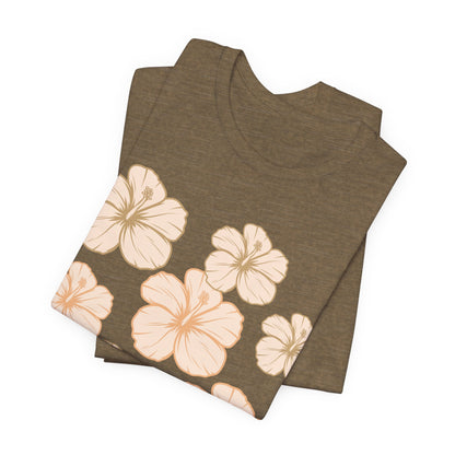 Folded olive Hibiscus All Over Graphic Tee featuring scattered tropical hibiscus flowers on a soft unisex tee inspired by island life in Hawaii.