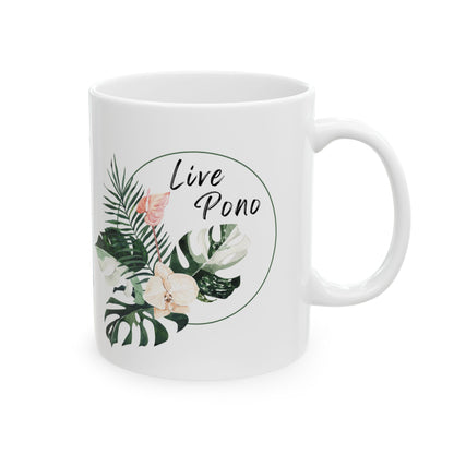 A white ceramic mug with a tropical leaf and flower illustration, featuring the text 'Live Pono' inside a circular outline on the front, set against a plain white background.