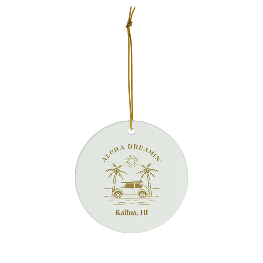 White ceramic ornament with gold Aloha Dreamin’ Kailua HI design featuring a retro surf car, palm trees and sun.