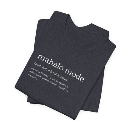 A folded dark charcoal gray heather t-shirt with a white printed dictionary-style definition of 'mahalo mode' on the chest, shown against a plain white background.