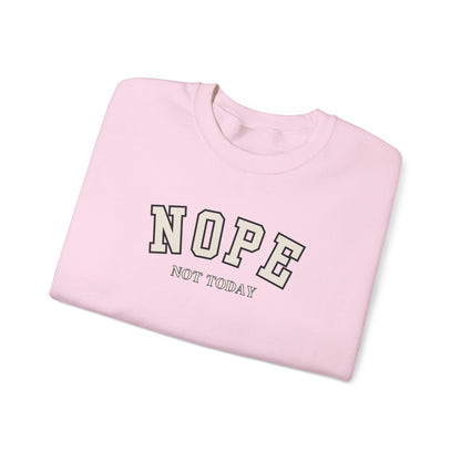 A folded light pink crewneck sweatshirt with the words 'NOPE NOT TODAY' printed on the front in a varsity-style font, shown on a clean white background.