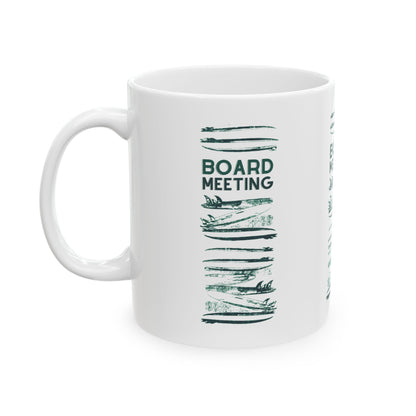 A white ceramic mug with a dark green graphic print featuring the text 'BOARD MEETING' above a stylized stack of stacked boards, shown on a plain white background.