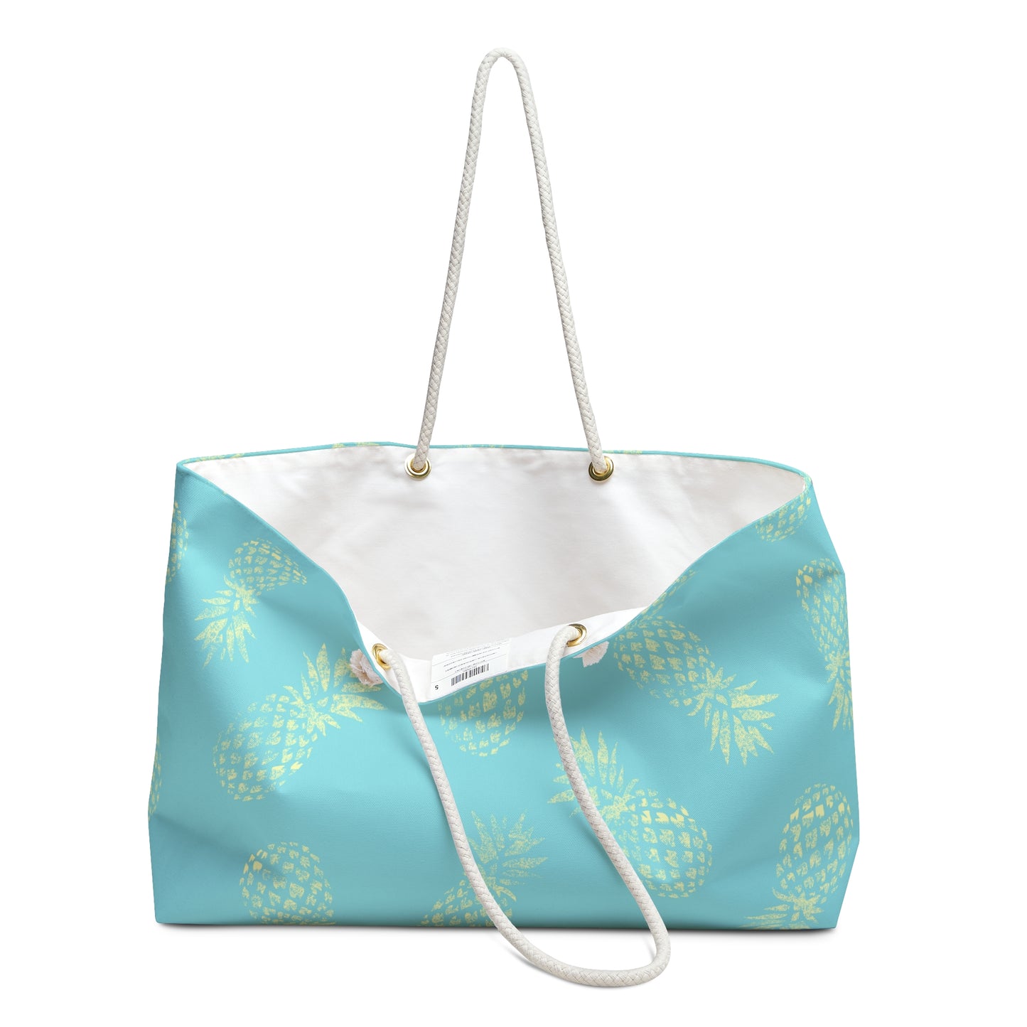 A turquoise blue tote bag with a yellow pineapple pattern, featuring a white rope handle and a white interior lining.