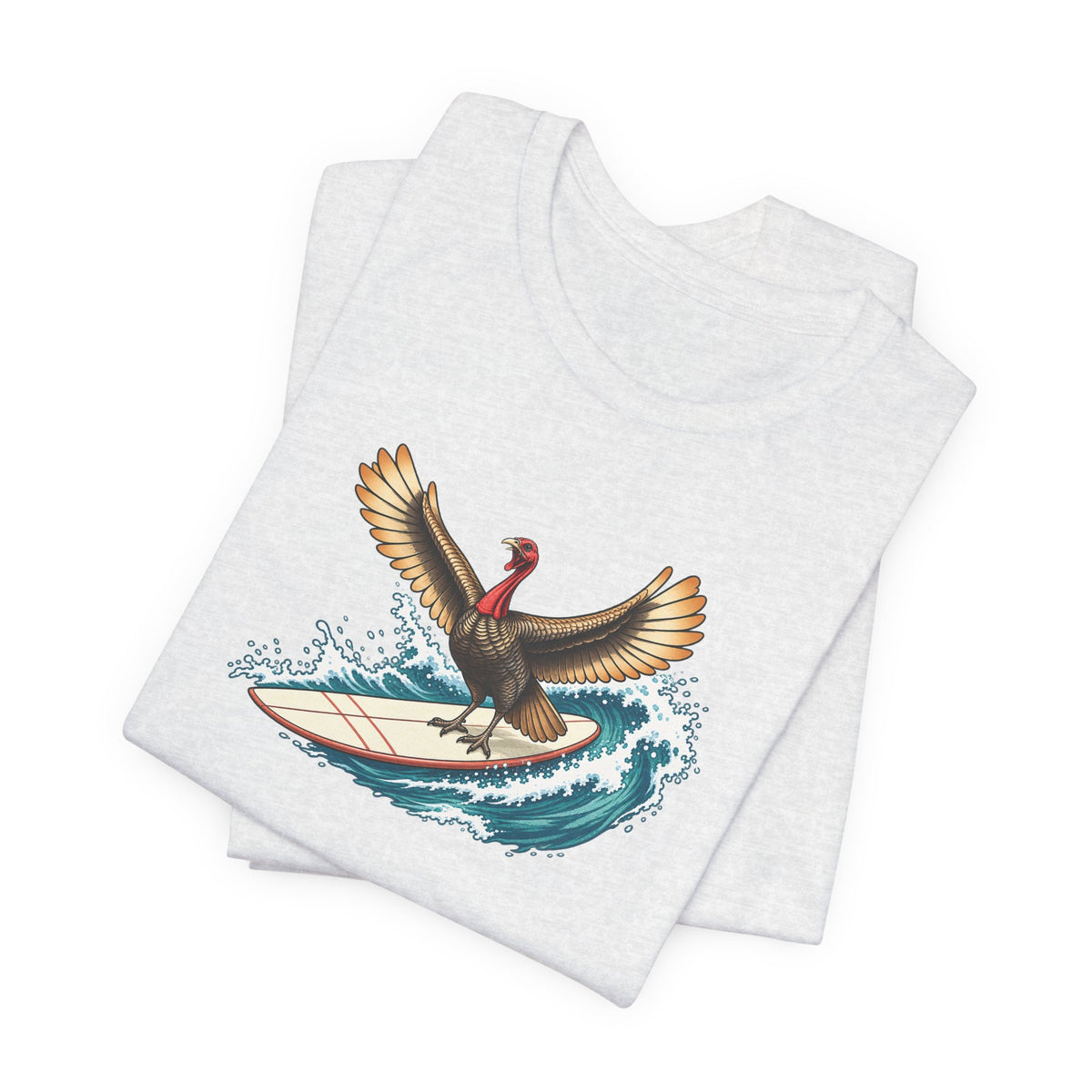 Ash gray surfing turkey Thanksgiving T-shirt featuring a teal wave and vintage-inspired island artwork folded