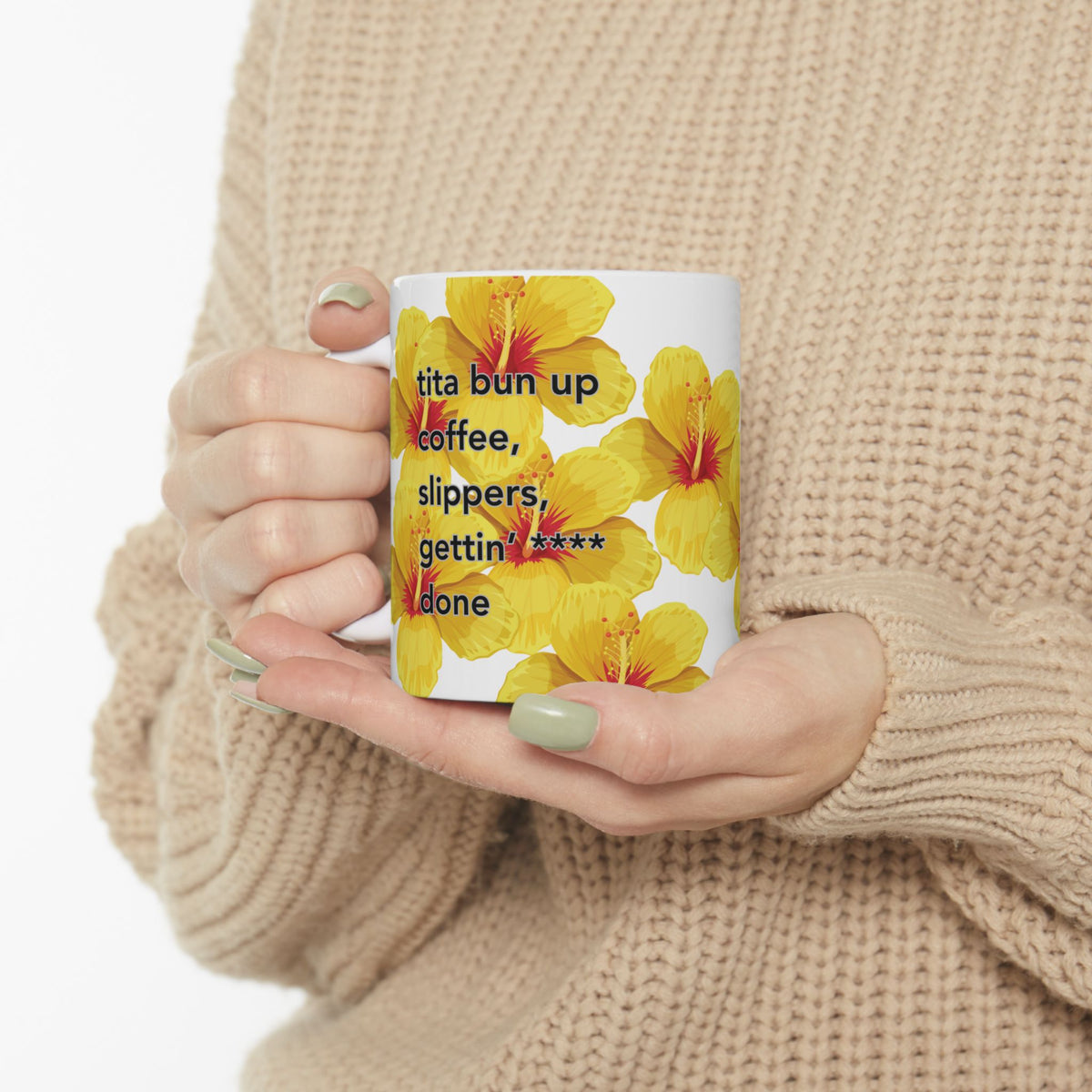 Woman holding Tita Bun coffee mug with yellow hibiscus design by Global Village Kailua