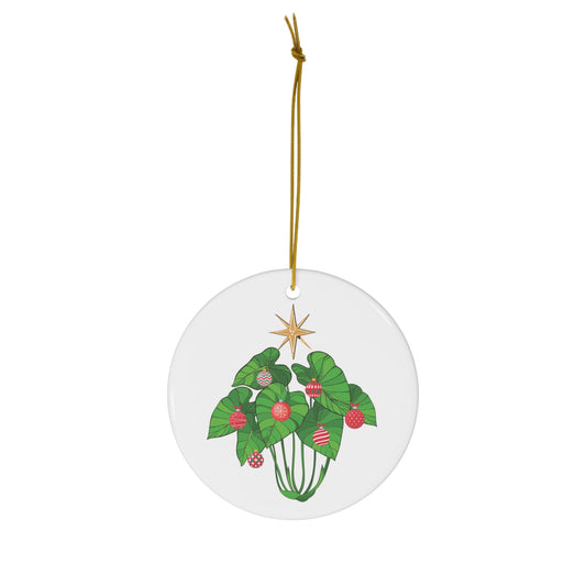 White ceramic Kalo Kalikimaka ornament featuring green kalo leaves decorated with red Christmas ornaments and a golden star.