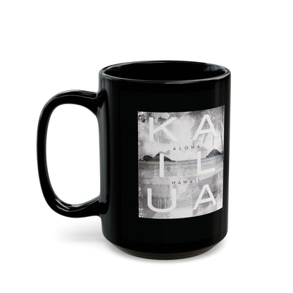 A glossy black ceramic mug featuring a square grayscale graphic print on the front with the words 'KAILUA', 'ALOHA', and 'HAWAII' over a landscape image, shown on a white background.