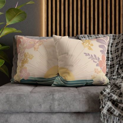 2 pastel sunrise wave faux suede pillows, featuring tropical florals and ocean-inspired artwork sitting on a couch in a living room