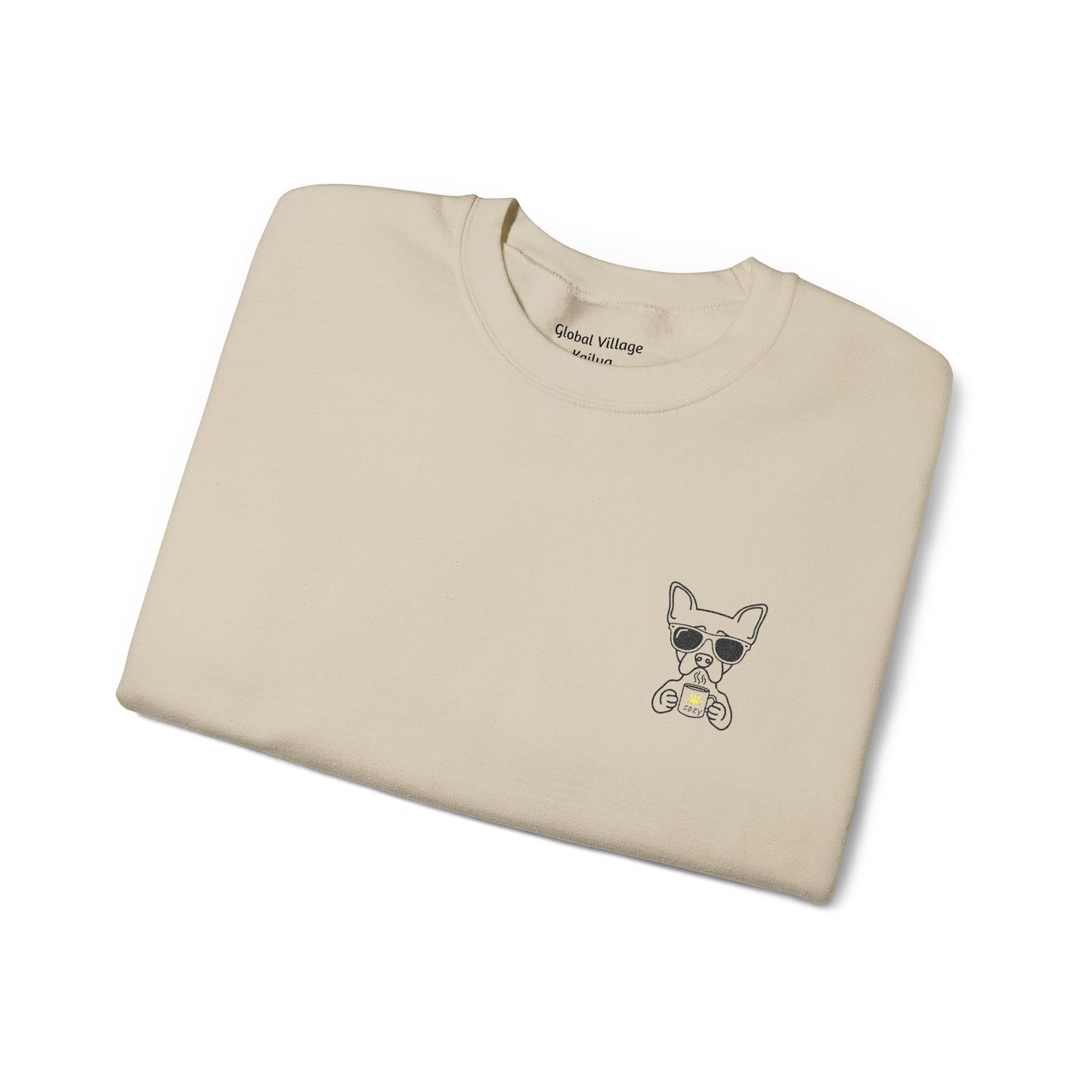 Folded sand sweatshirt with an embroidered dog drinking a cup of coffee on a white background