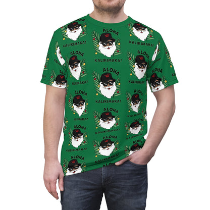 Man wearing Green Aloha Kalikimaka Hawaiian Christmas tee with all-over Santa, tropical leaves and holiday ornament print