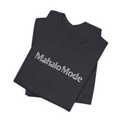 A folded Mahalo Mode graphic tee in dark grey heather with white outlined lettering, Global Village Kailua original design.