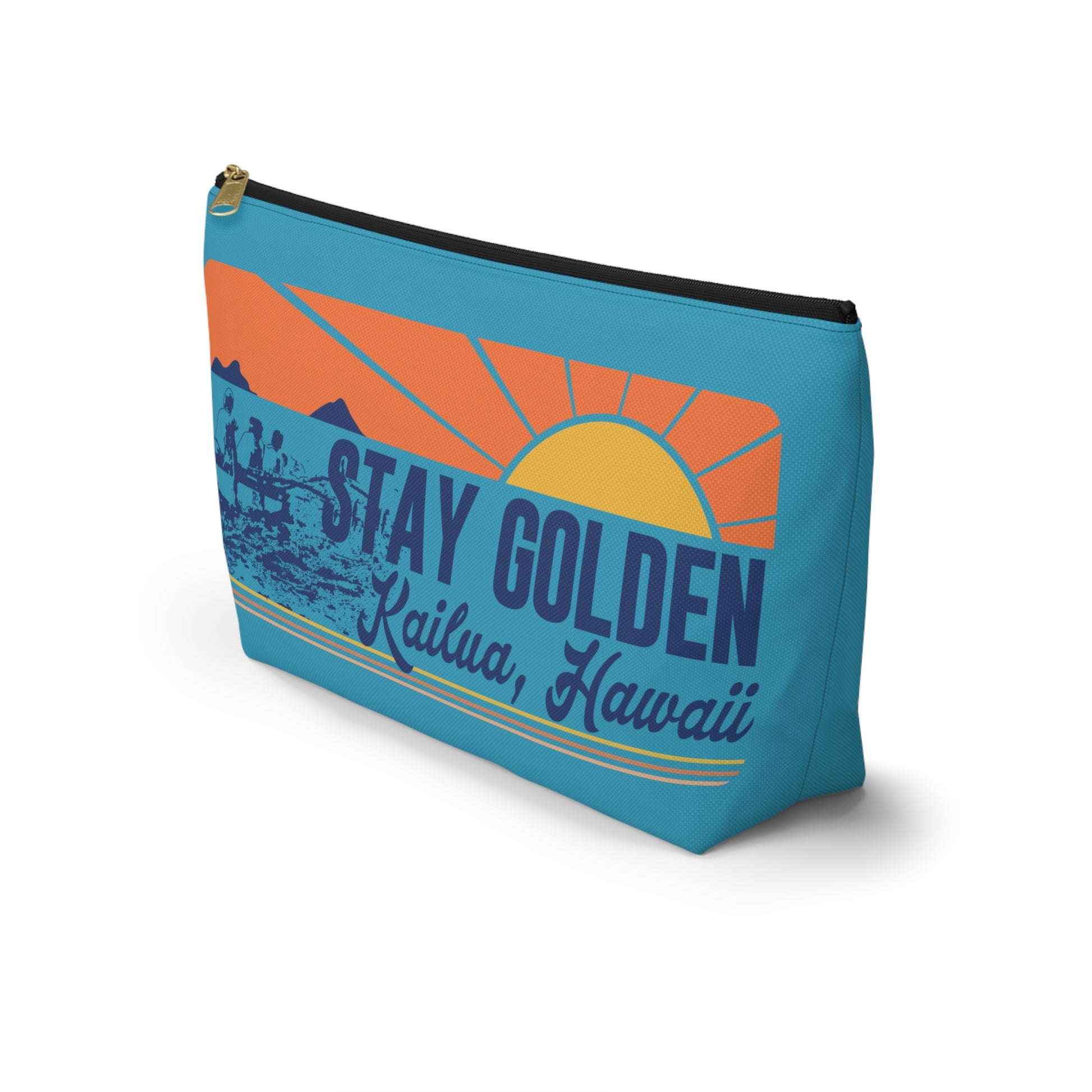 A rectangular zippered pouch with a blue background and a retro sunset graphic. The graphic features an orange and yellow sun, mountains, and the text 'STAY GOLDEN' and 'Kailua, Hawaii' in blue and yellow.