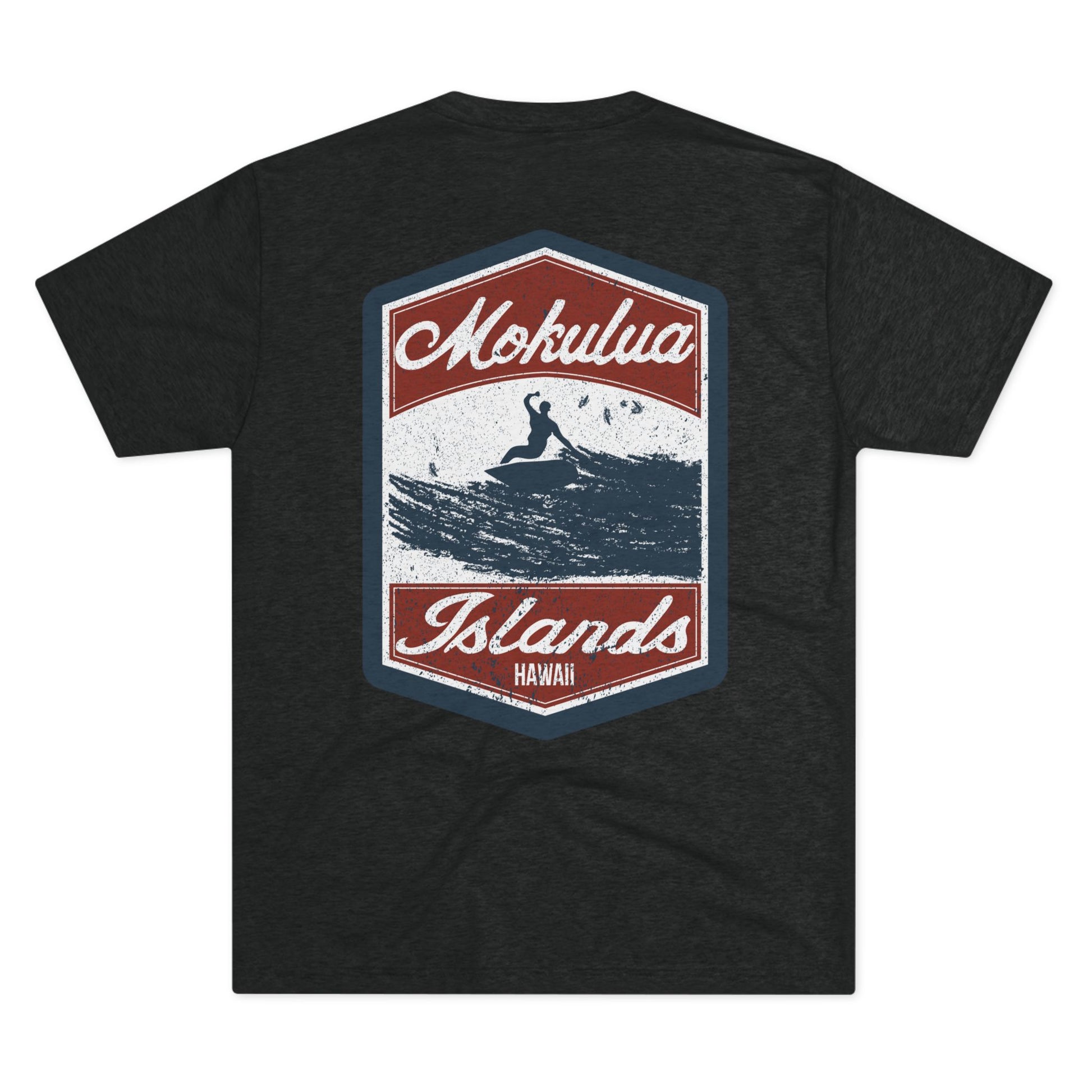 Back of Mokulua Islands Surf triblend T-shirt featuring a large vintage-inspired graphic of a surfer and the Mokulua Islands black tee by Global Village Kailua.