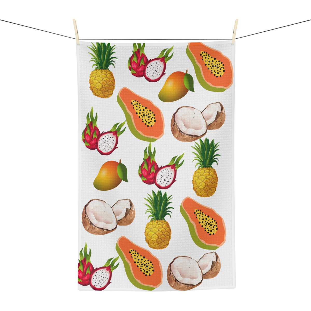 A white rectangular kitchen towel featuring a colorful repeating pattern of tropical fruits, including papayas, pineapples, mangoes, dragon fruit, coconuts, and a whole mango, shown on a plain white background.