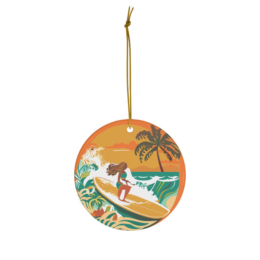 Round ceramic ornament featuring a retro Castle Point surf scene with woman surfer, tropical waves, palm tree and orange sunset.