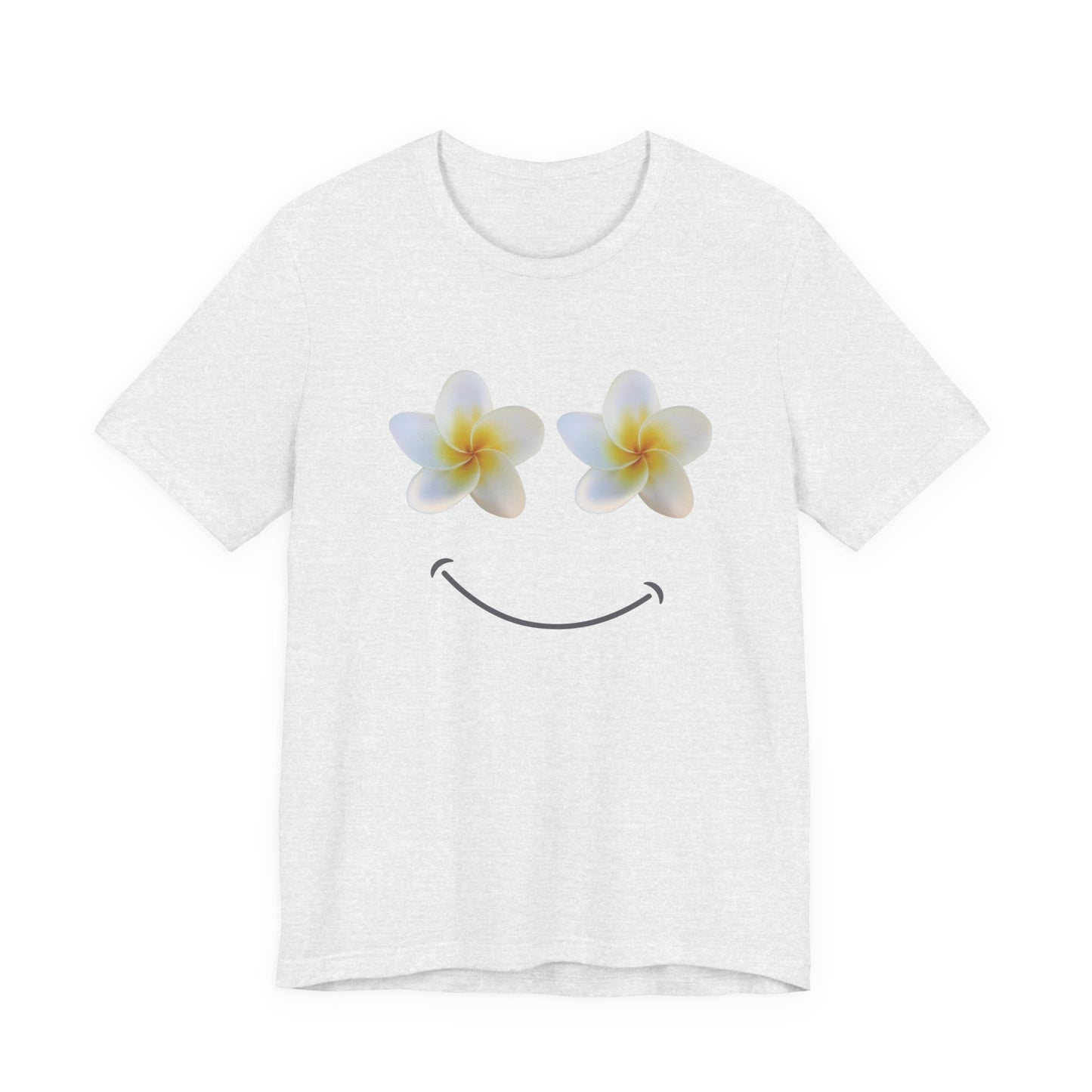 An ash white short-sleeve crewneck t-shirt featuring a graphic of two plumeria flowers acting as eyes and a simple black smiley face below, displayed on a clean white background.