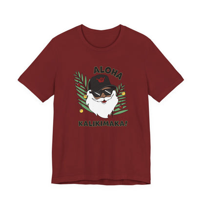 Cardinal Red Santa Kalikimaka unisex T-shirt with hand-drawn Santa wearing sunglasses and throwing a shaka surrounded by tropical palm leaves.