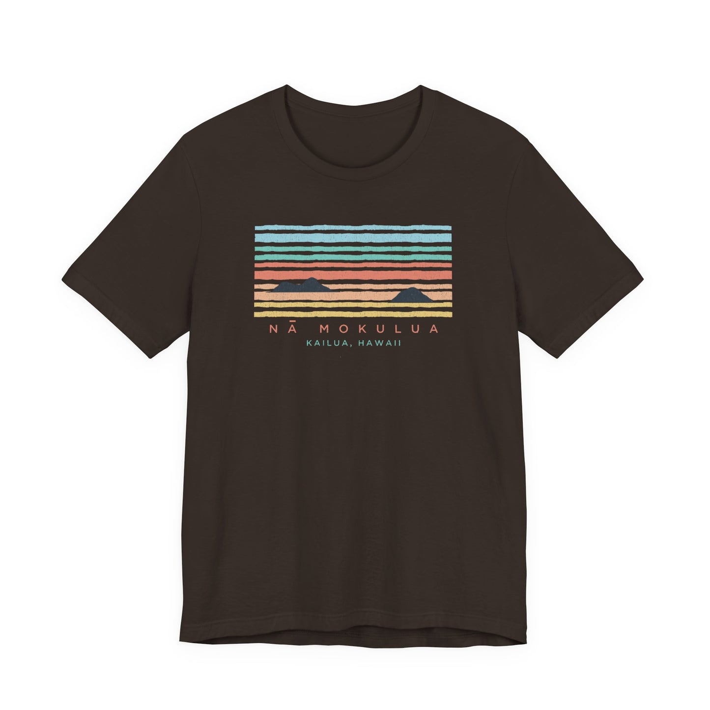 A dark brown short-sleeve t-shirt with a retro sunset graphic on the chest featuring horizontal stripes in light blue, teal, orange, and red, with the text 'NA MOKULUA KAILUA, HAWAII' printed below.