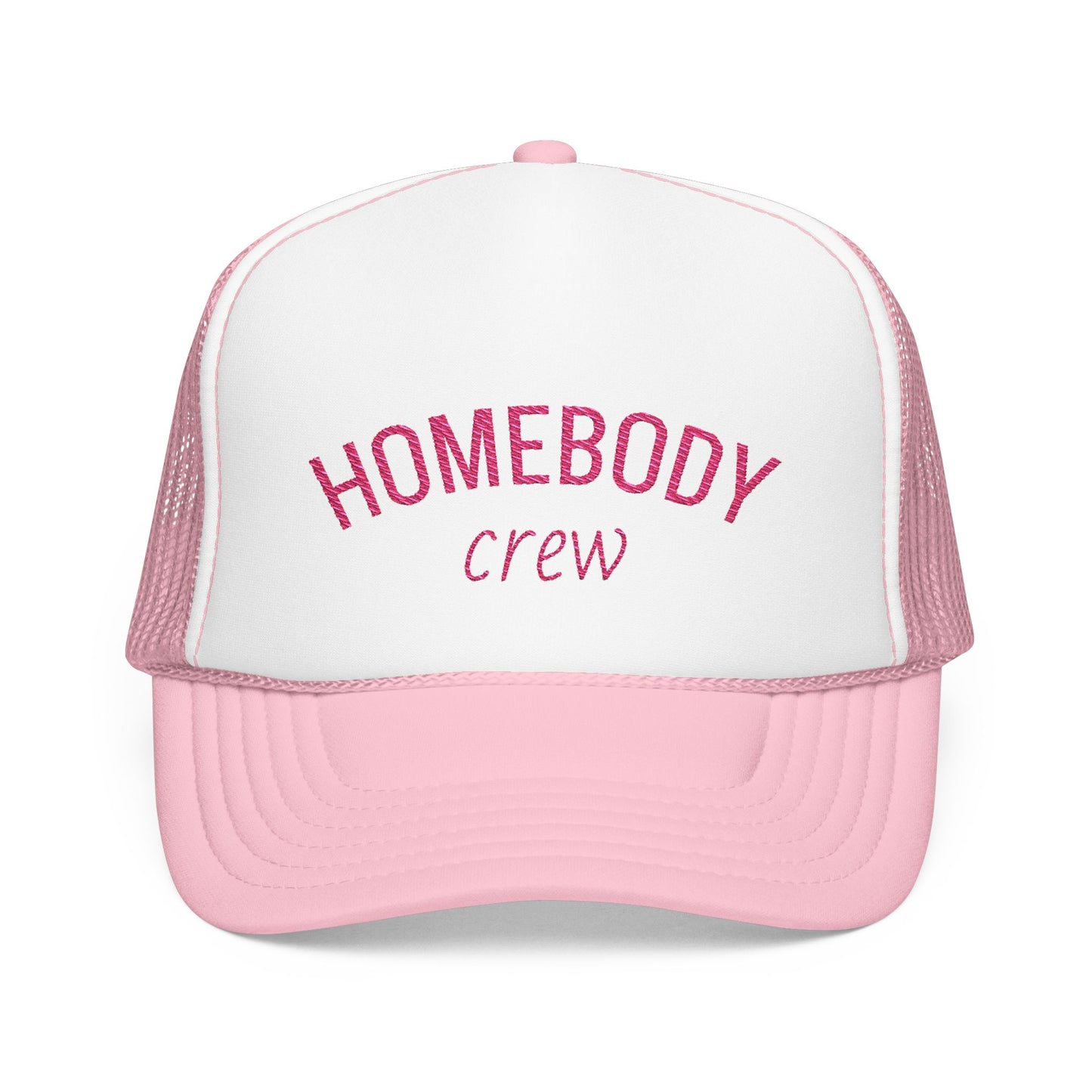 A pink and white trucker hat with 'HOMEBODY crew' embroidered on the front, shown against a plain white background.